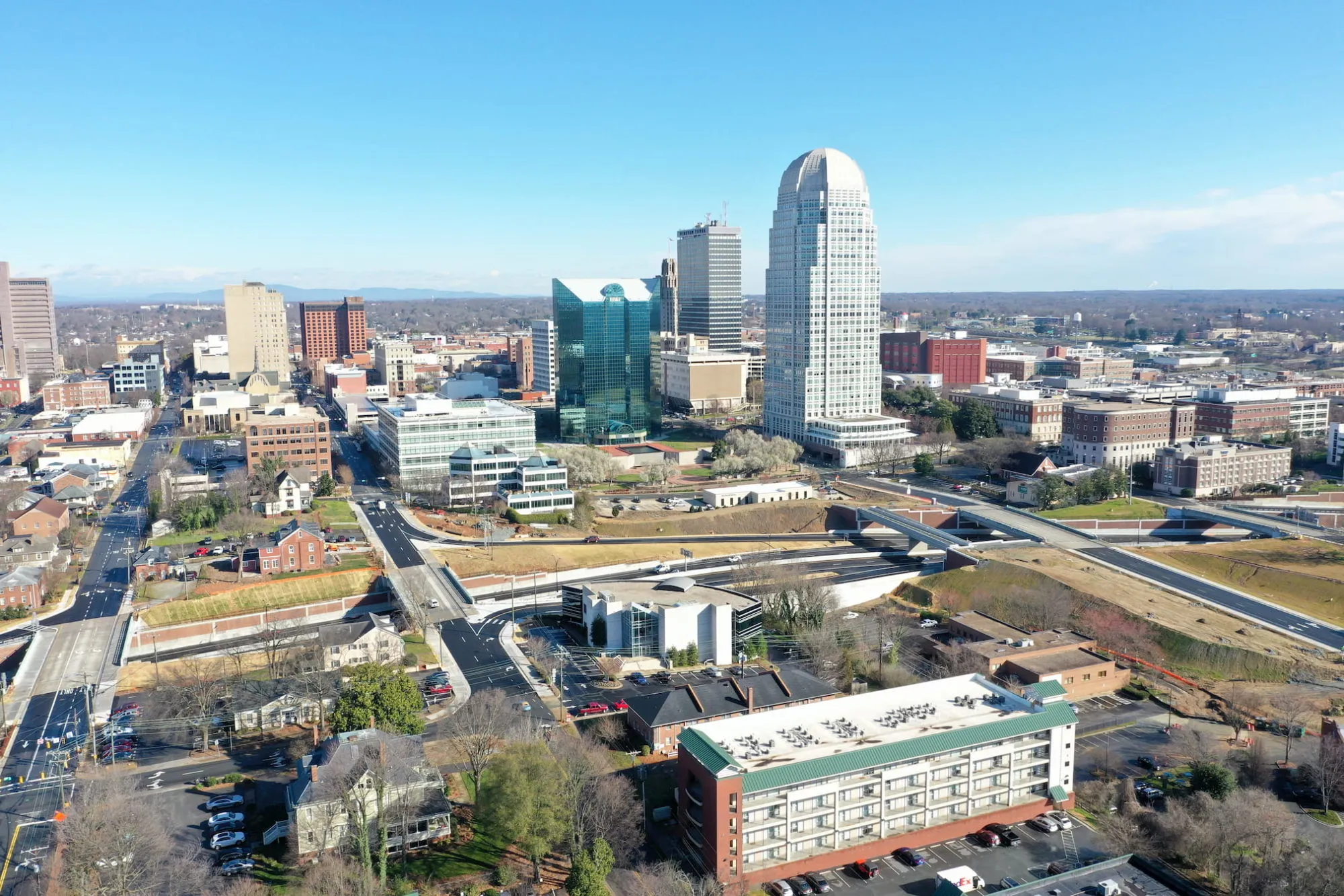 Aerial view of downtown Winston-Salem, NC, highlighting the commercial real estate market served by Meridian Realty Services.